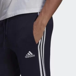 ADIDAS Essentials Fleece Fitted 3-Stripes Broek -Trend Kledij Verkoop essentials fleece fitted 3 stripes broek 3